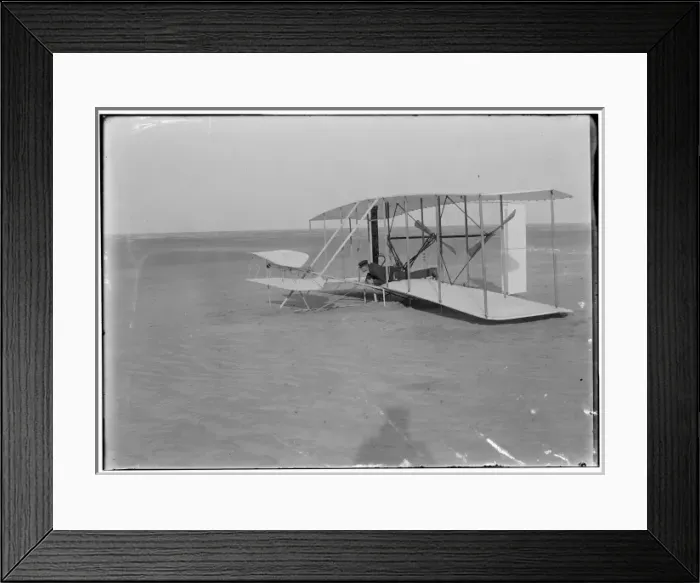 Framed Print : Wilbur in prone position in damaged machine, on ground after Framed Print : Wilbur in prone position in damaged machine, on ground after