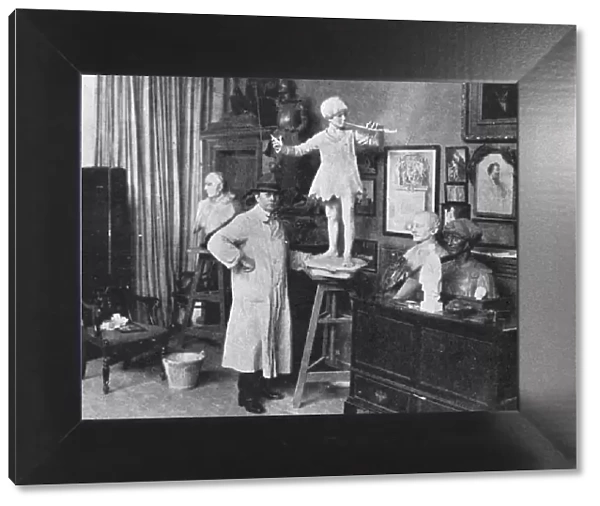 Sir George Frampton in studio with Peter Pan statue