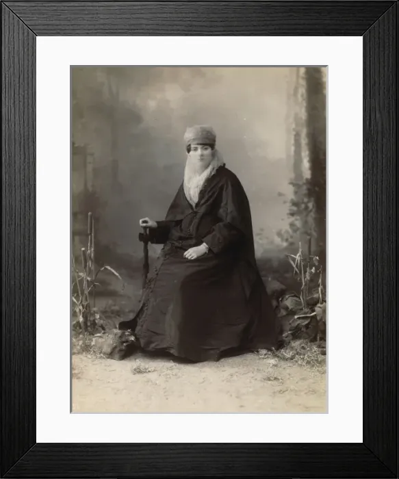 Framed Print : Turkish woman, full-length portrait, seated, facing front, h Framed Print : Turkish woman, full-length portrait, seated, facing front, h