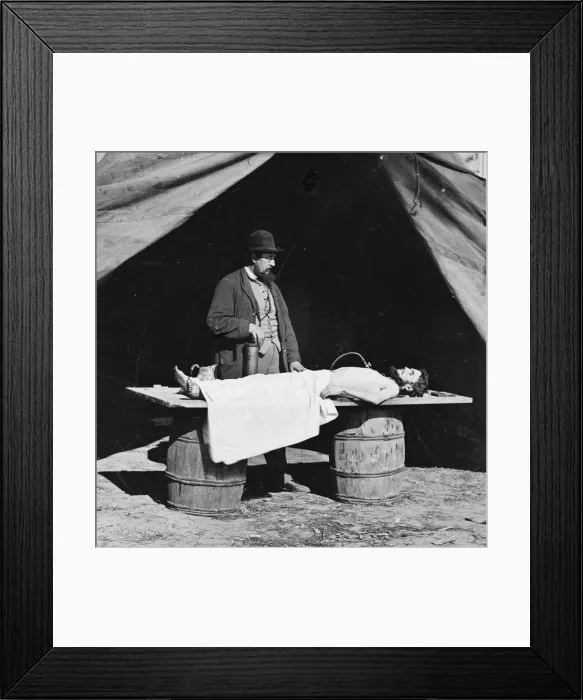 Framed Print : Unknown location. Embalming surgeon at work on soldiers bod Framed Print : Unknown location. Embalming surgeon at work on soldiers bod