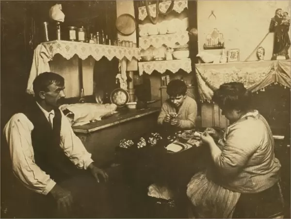 Cardinale family making silk flowers. Father wears a cast. D