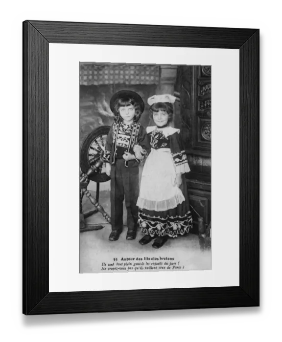 Framed Print : Two country bumpkins posing next to a spinning wheel Framed Print : Two country bumpkins posing next to a spinning wheel