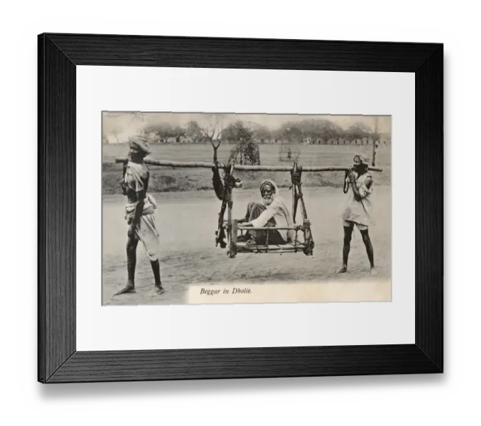 Framed Print : Dhule, India - A beggar is carried in a two-man litter Framed Print : Dhule, India - A beggar is carried in a two-man litter