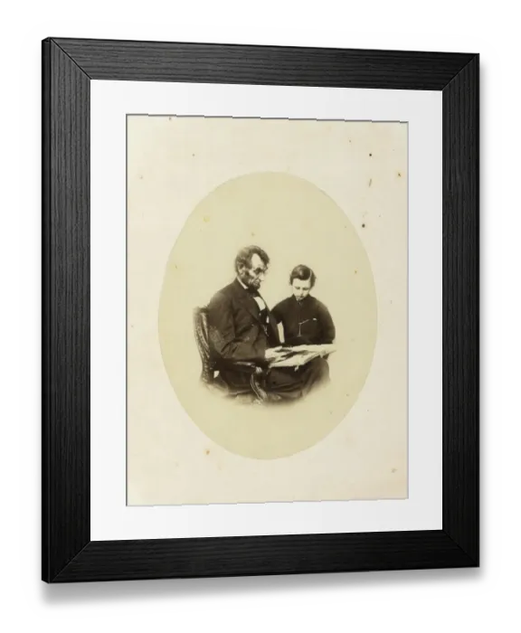 Framed Print : Abraham Lincoln, US President, looking at a photo album with Framed Print : Abraham Lincoln, US President, looking at a photo album with