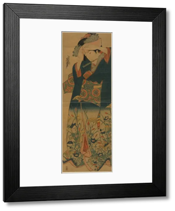 Framed Print : Young woman adjusting her hat Framed Print : Young woman adjusting her hat
