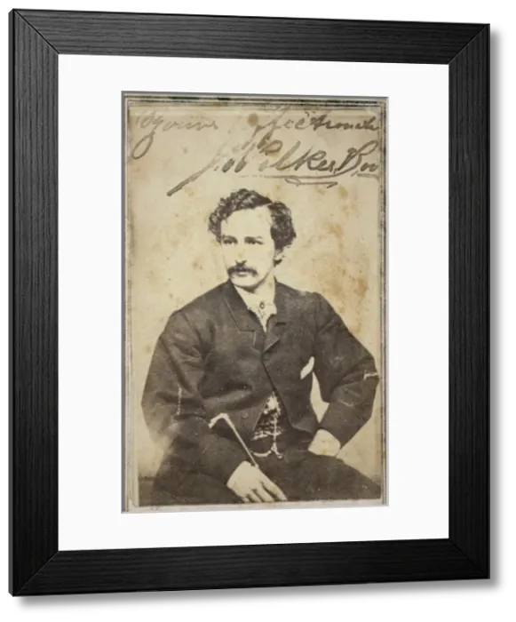 Framed Print : John Wilkes Booth, half-length studio portrait, sitting Framed Print : John Wilkes Booth, half-length studio portrait, sitting