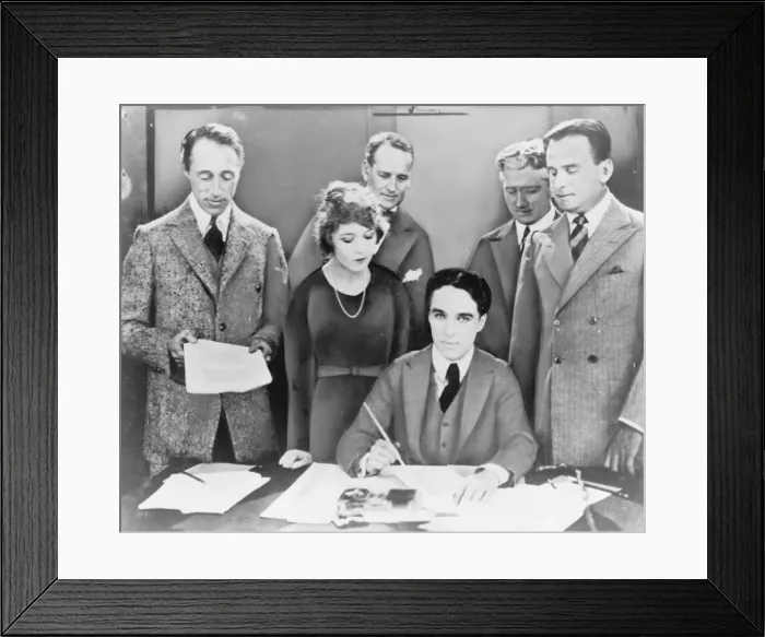 Framed Print : DW Griffith, Mary Pickford, Charlie Chaplin (seated) and Dou