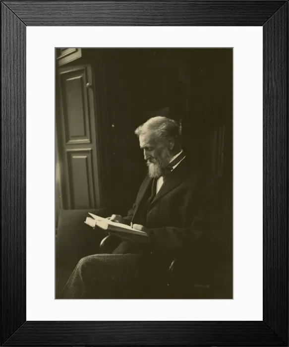 Framed Print : John Muir, seated, reading a book Framed Print : John Muir, seated, reading a book