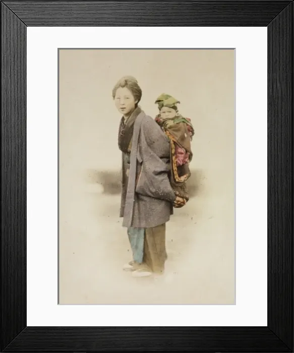 Framed Print : Mother carrying child on her back Framed Print : Mother carrying child on her back