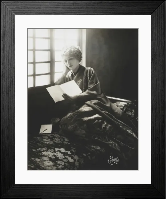 Framed Print : Mary Pickford, wearing a kimono, reading a letter Framed Print : Mary Pickford, wearing a kimono, reading a letter