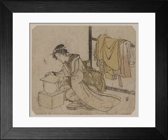 Framed Print : Young lady removing a kemari (ball) from its box Framed Print : Young lady removing a kemari (ball) from its box