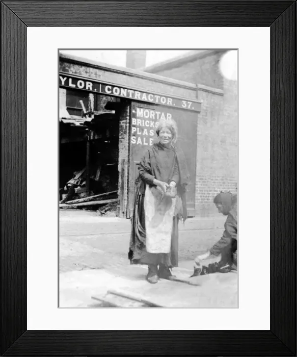 Framed Print : Slum life. Slum Life, woman holding a shoe, 1892 Date: 1892 Framed Print : Slum life. Slum Life, woman holding a shoe, 1892 Date: 1892
