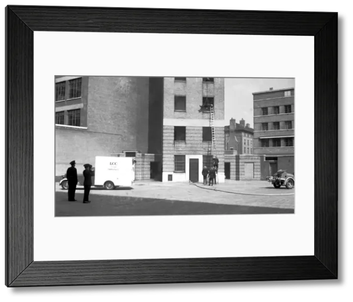 Framed Print : Rescue, lowering line from drill tower, Lambeth HQ Framed Print : Rescue, lowering line from drill tower, Lambeth HQ