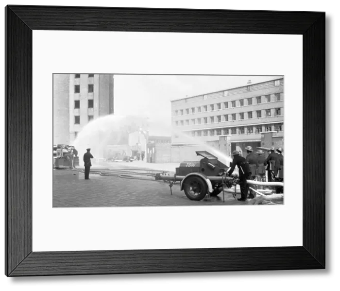 Framed Print : Auxiliary firefighters at drill, Lambeth HQ, WW2 Framed Print : Auxiliary firefighters at drill, Lambeth HQ, WW2