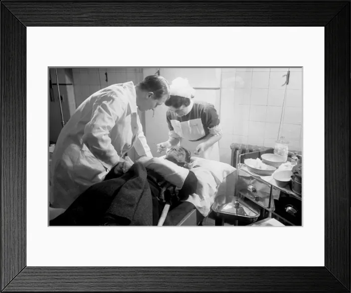 Framed Print : Blitz in London -- AFS personnel receiving treatment, WW2 Framed Print : Blitz in London -- AFS personnel receiving treatment, WW2