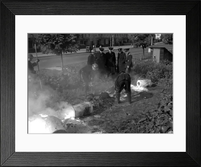 Framed Print : Firefighters deal with small fire caused by explosion, WW2 Framed Print : Firefighters deal with small fire caused by explosion, WW2