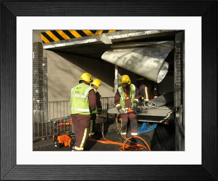 Framed Print : Firefighters working to remove van trapped under bridge Framed Print : Firefighters working to remove van trapped under bridge