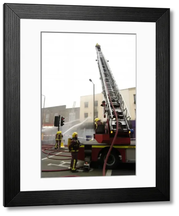 Framed Print : Firefighters at scene of fire, Stockwell Road, Brixton Framed Print : Firefighters at scene of fire, Stockwell Road, Brixton