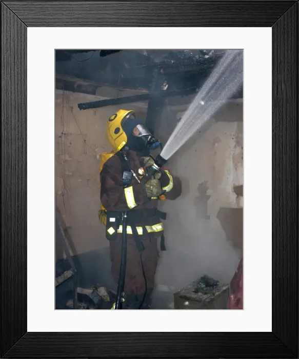 Framed Print : Firefighter in breathing apparatus working at fire Framed Print : Firefighter in breathing apparatus working at fire