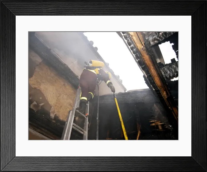 Framed Print : Firefighter in breathing apparatus working at fire Framed Print : Firefighter in breathing apparatus working at fire