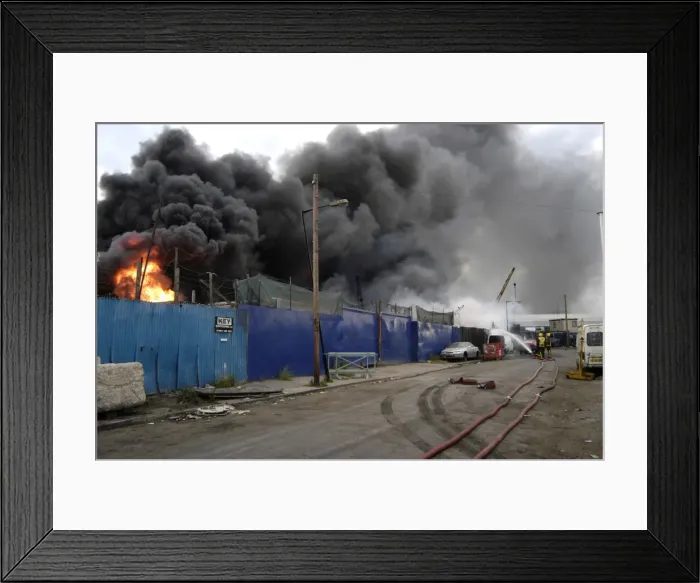 Framed Print : London Fire Brigade firefighters respond to a fire