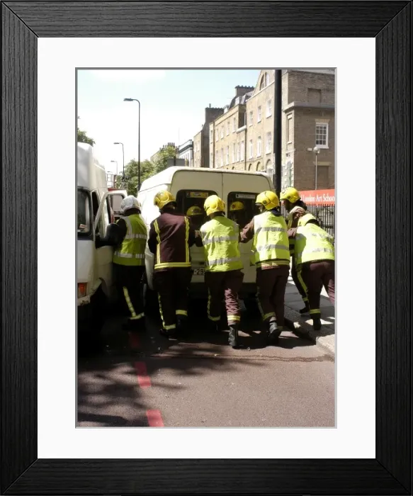 Framed Print : Firefighters pushing a broken down Ford transit van Framed Print : Firefighters pushing a broken down Ford transit van