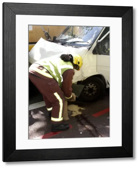 Framed Print : Firefighters inspecting a broken down Ford transit van Framed Print : Firefighters inspecting a broken down Ford transit van