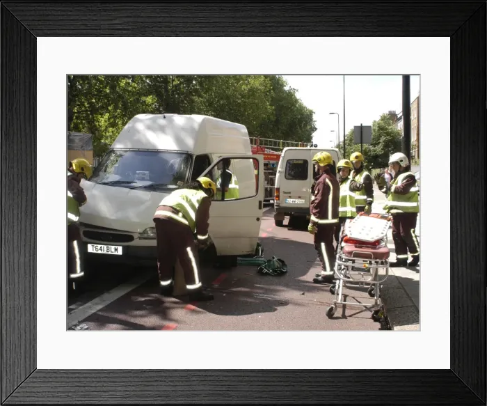 Framed Print : Firefighters inspecting a broken down Ford transit van Framed Print : Firefighters inspecting a broken down Ford transit van