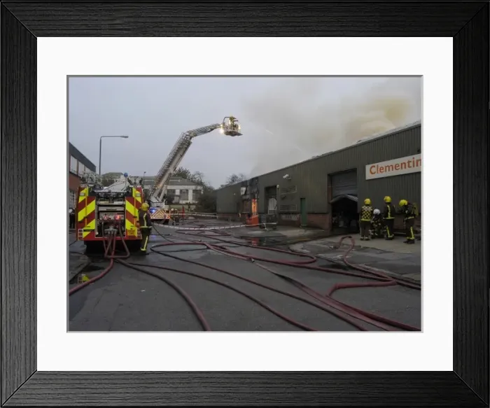 Framed Print : Firefighters in a hydraulic lift Framed Print : Firefighters in a hydraulic lift