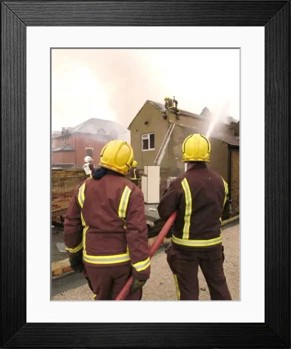 Framed Print : Firefighters at the scene of an explosion Framed Print : Firefighters at the scene of an explosion