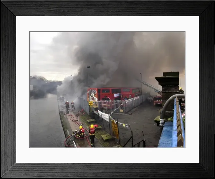 Framed Print : Firefighters attend fire at bus garage Framed Print : Firefighters attend fire at bus garage