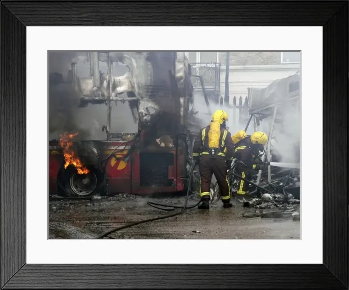 Framed Print : Firefighters attend fire at bus garage Framed Print : Firefighters attend fire at bus garage