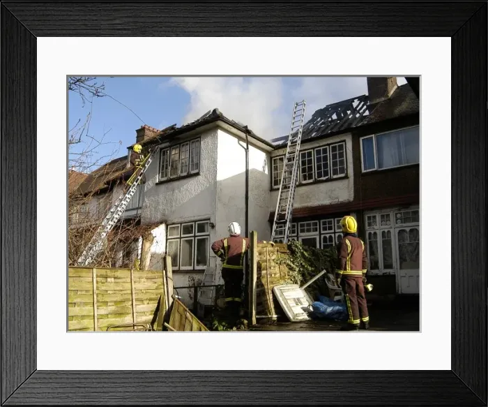 Framed Print : Firefighters dealing with a house fire Framed Print : Firefighters dealing with a house fire