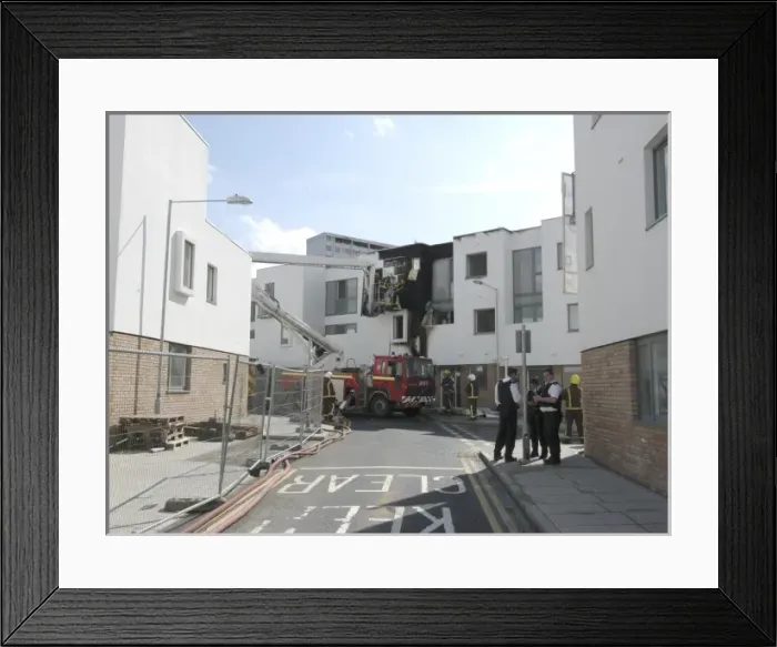 Framed Print : A hydraulic lift vehicle at the scene of a fire Framed Print : A hydraulic lift vehicle at the scene of a fire