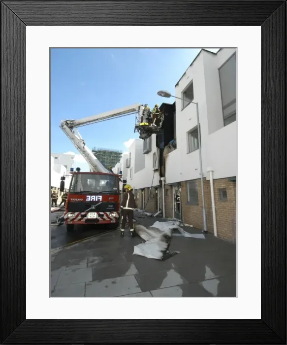 Framed Print : A hydraulic lift vehicle at the scene of a fire Framed Print : A hydraulic lift vehicle at the scene of a fire