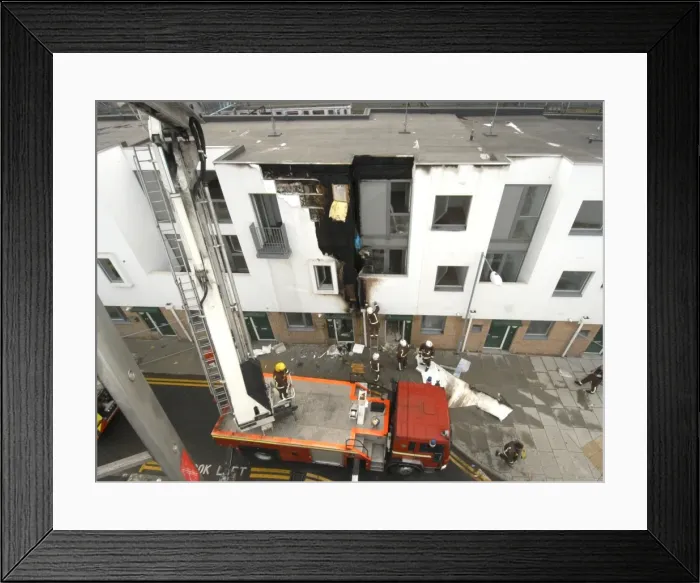 Framed Print : A hydraulic lift vehicle at the scene of a fire Framed Print : A hydraulic lift vehicle at the scene of a fire