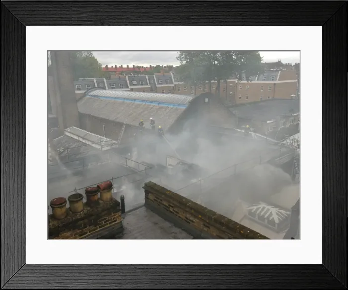 Framed Print : Firefighters working at scene of commercial fire Framed Print : Firefighters working at scene of commercial fire