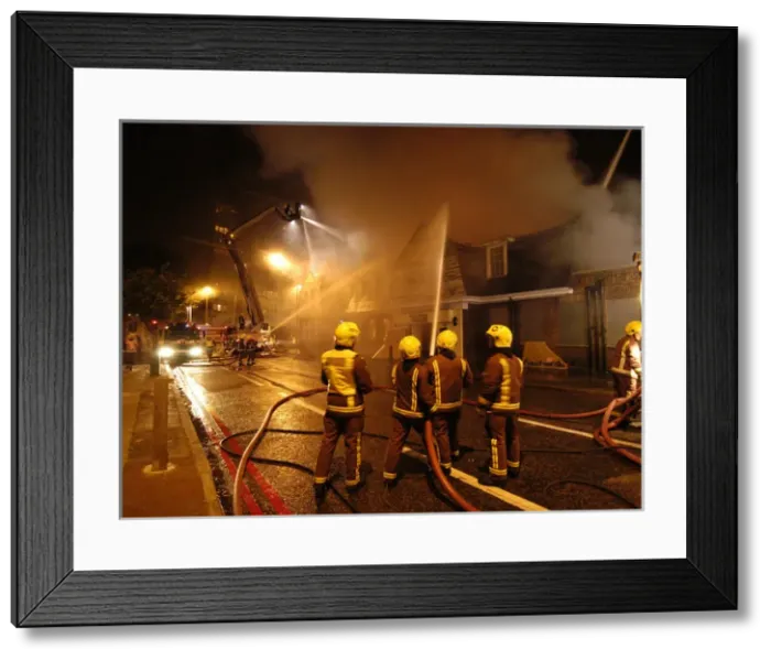 Framed Print : Firefighters working at scene of pub fire, SE London Framed Print : Firefighters working at scene of pub fire, SE London