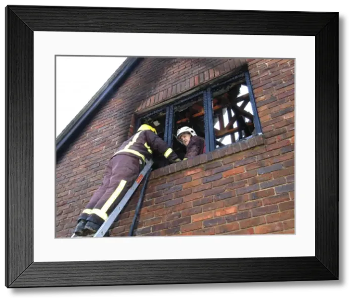 Framed Print : Firefighters working at scene of domestic fire, Harrow Framed Print : Firefighters working at scene of domestic fire, Harrow