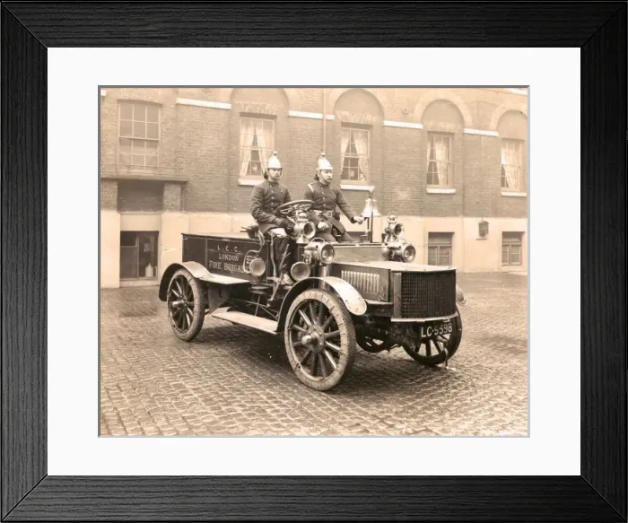 Framed Print : Firefighters in a motorised pump vehicle Framed Print : Firefighters in a motorised pump vehicle