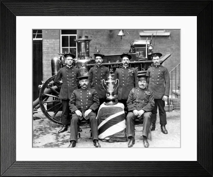 Framed Print : Firefighters pose in front of a steam pump Framed Print : Firefighters pose in front of a steam pump