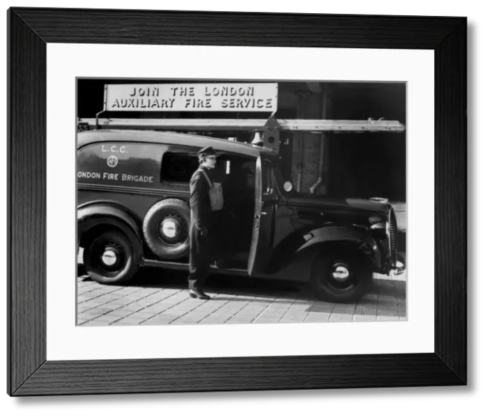 Framed Print : Auxiliary Fire Service member with van, WW2 Framed Print : Auxiliary Fire Service member with van, WW2