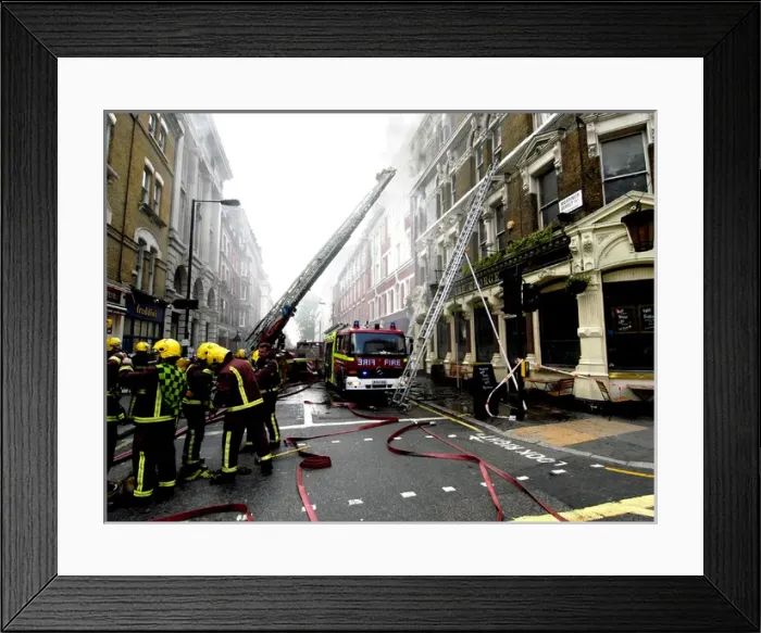 Framed Print : Firefighters using turntable ladder Framed Print : Firefighters using turntable ladder