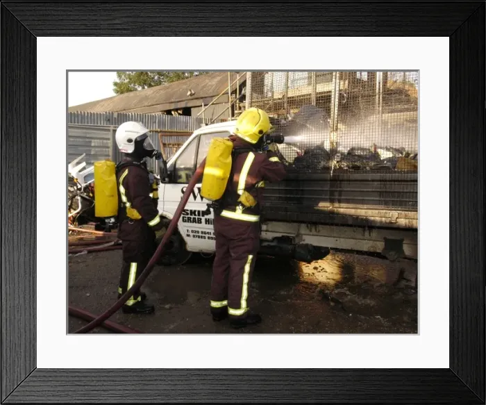Framed Print : Firefighters at the scene of an industrial fire Framed Print : Firefighters at the scene of an industrial fire