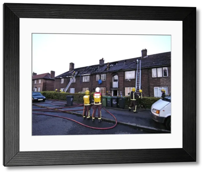 Framed Print : Firefighers at the scene of a house fire, SE London Framed Print : Firefighers at the scene of a house fire, SE London