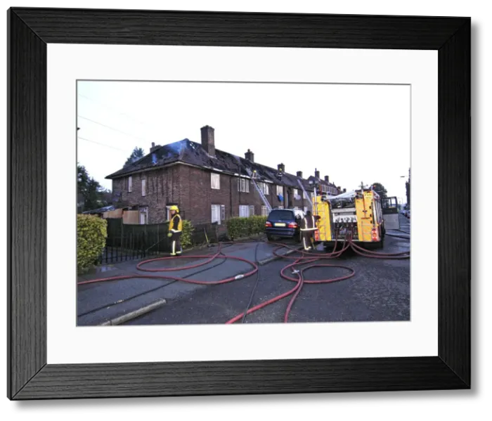 Framed Print : Firefighers at the scene of a house fire, SE London Framed Print : Firefighers at the scene of a house fire, SE London