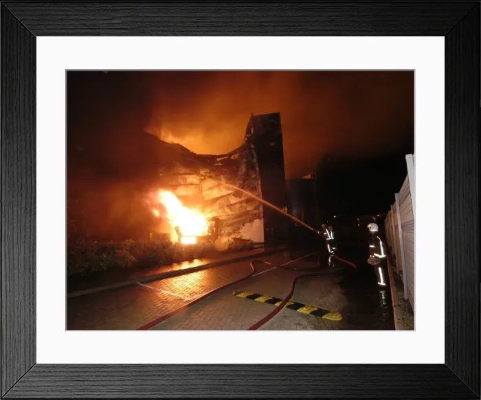 Framed Print : Firefighters working at scene of large warehouse fire Framed Print : Firefighters working at scene of large warehouse fire