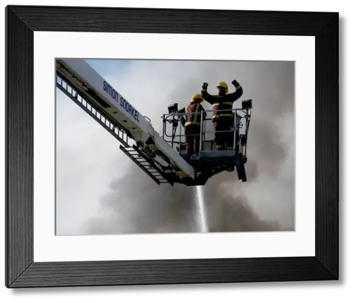 Framed Print : A hydraulic lift in action at scene of fire, Penge