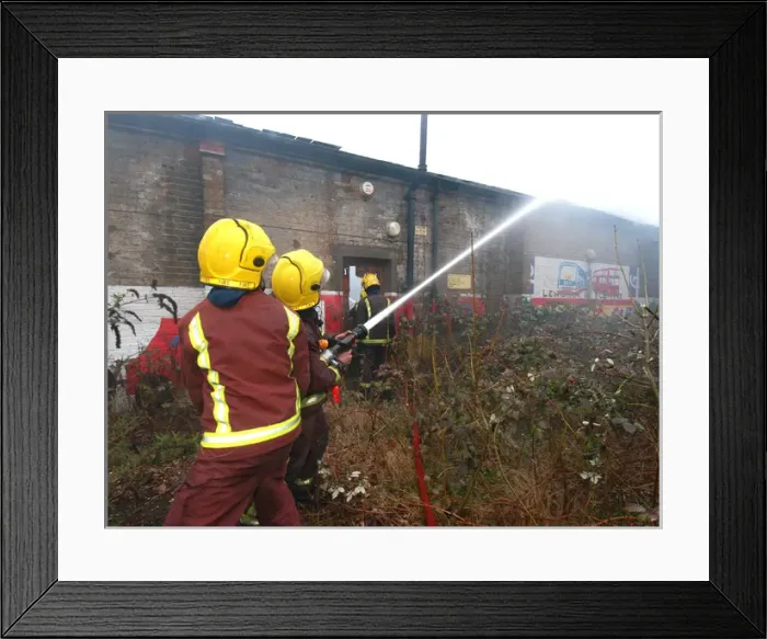 Framed Print : Firefighters at the scene of a warehouse fire, SE London Framed Print : Firefighters at the scene of a warehouse fire, SE London