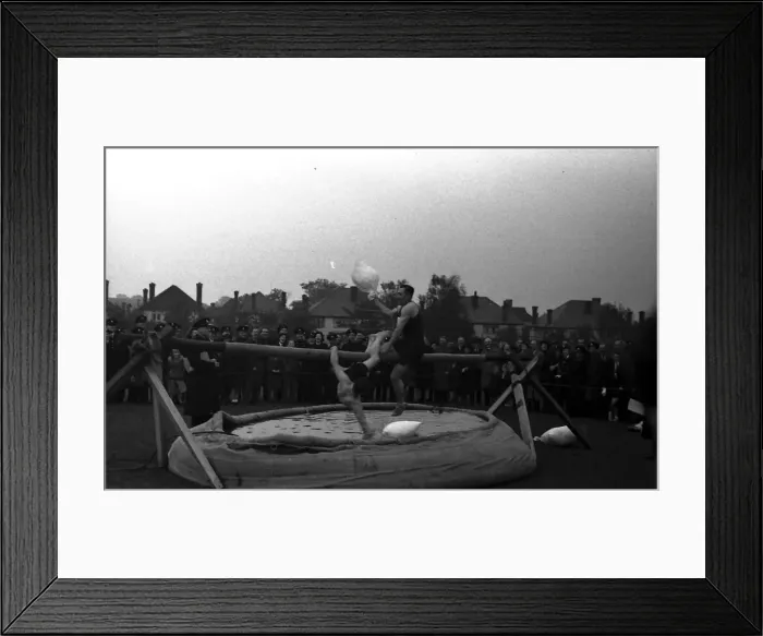 Framed Print : Slippery pole sack fighting Framed Print : Slippery pole sack fighting